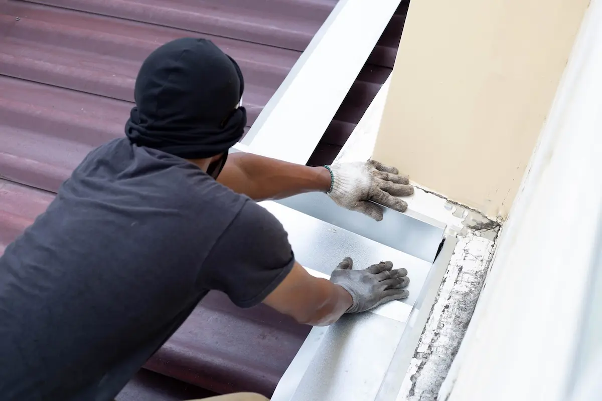 Professional roof leak inspection to identify flashing damage